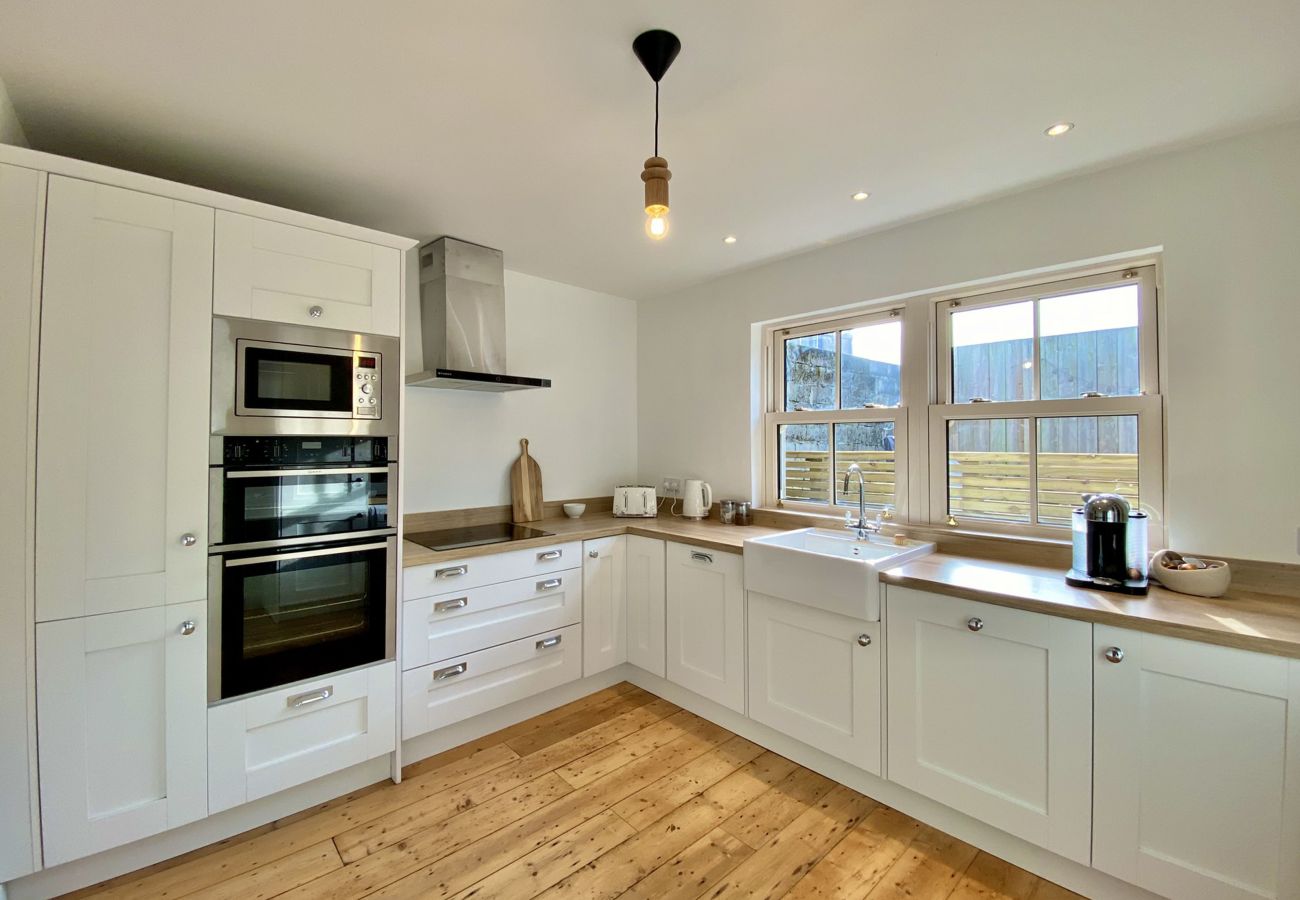 Clifden Town Townhouse. Connemara. Modern fully equipped kitchen. Bright new contemporary units. Wooden floors.