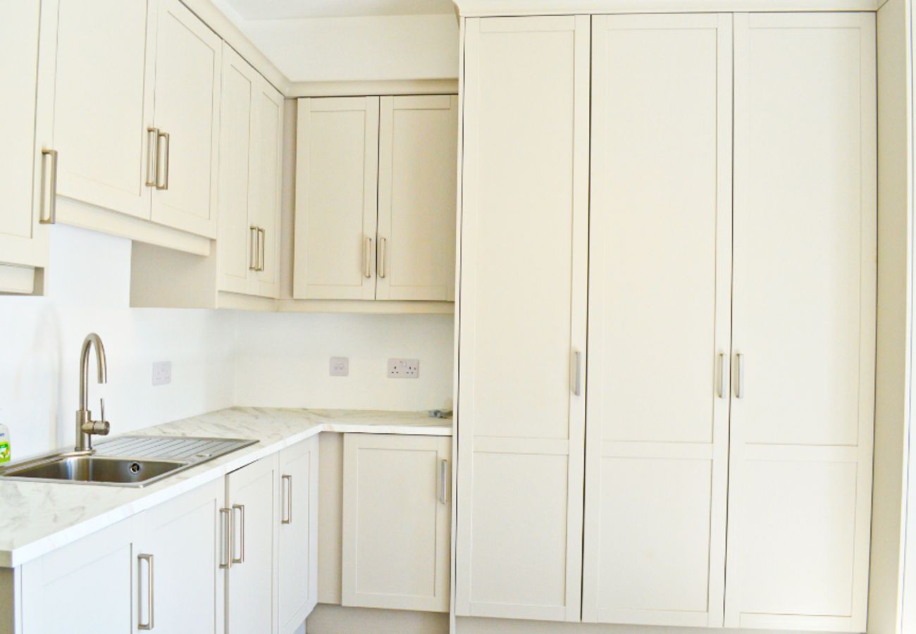Lough Conn Haven Holiday Home. Modern open plan kitchen. Built in ample storage, contemporary design. 