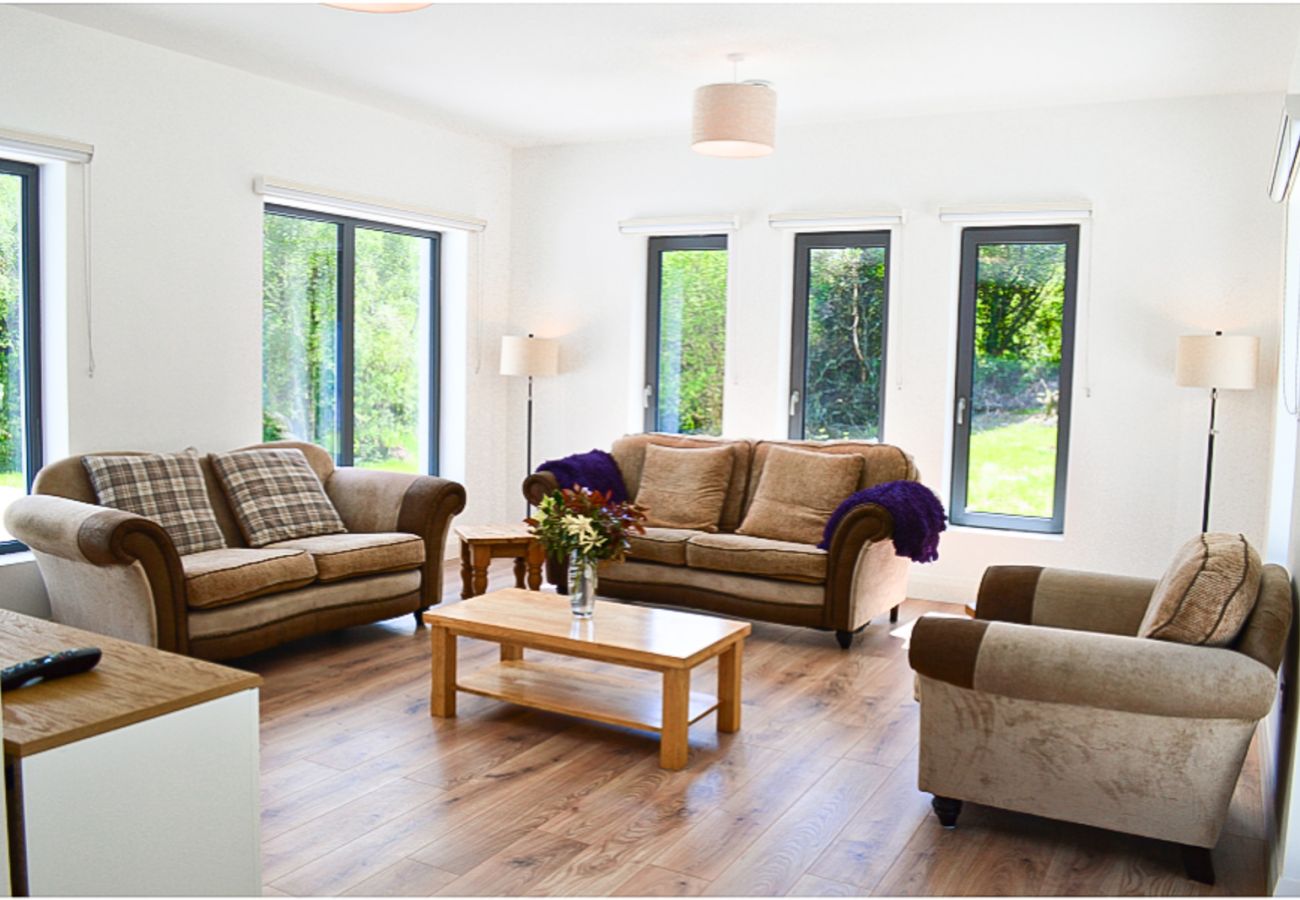 Lough Conn Haven Holiday Home. Open plan spacious bright lounge, lots of windows view to garden. 