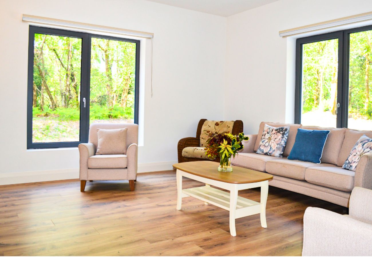 Lough Conn Haven Holiday Home. Open plan spacious bright lounge. Comfortable seating, coffee table, large bright windows. 