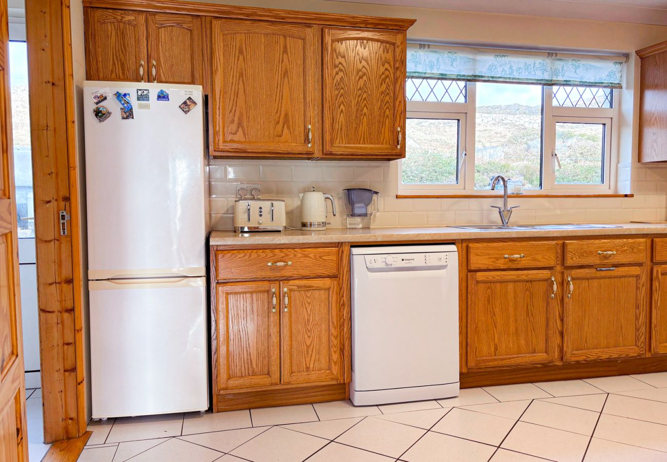 Kilkieran Holiday Home Connemara. Modern pine kitchen, tiled floor. 