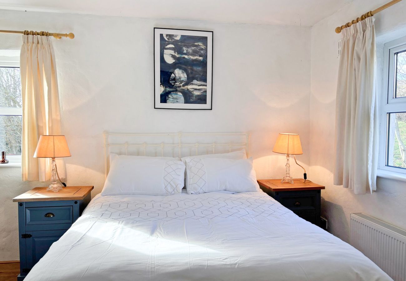 Moyard Stone Cottage, Connemara.  Double bedroom. simple white decor cottage style. 