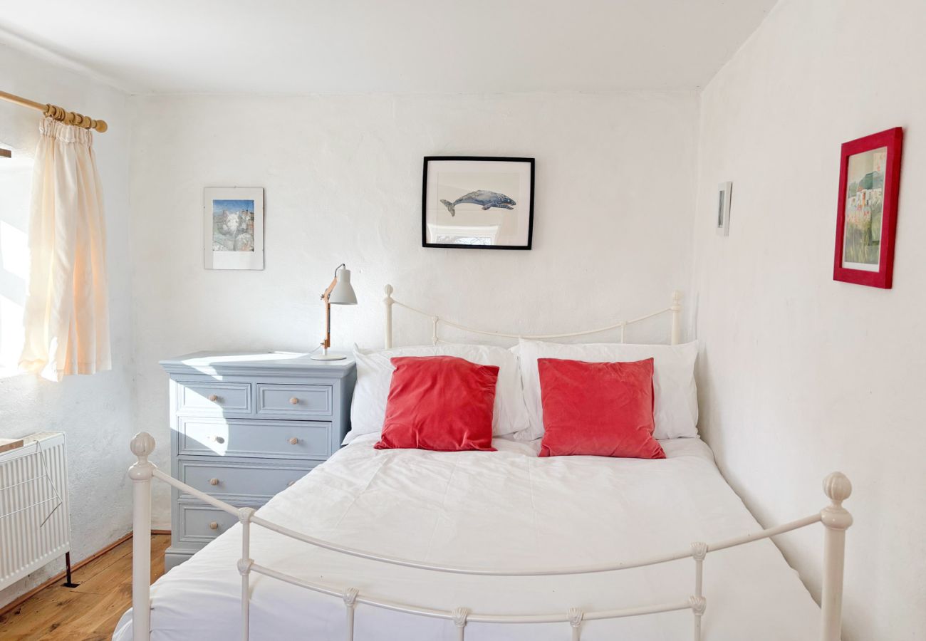 Moyard Stone Cottage, Connemara.  Double bed, bright white, simple cottage style room. 
