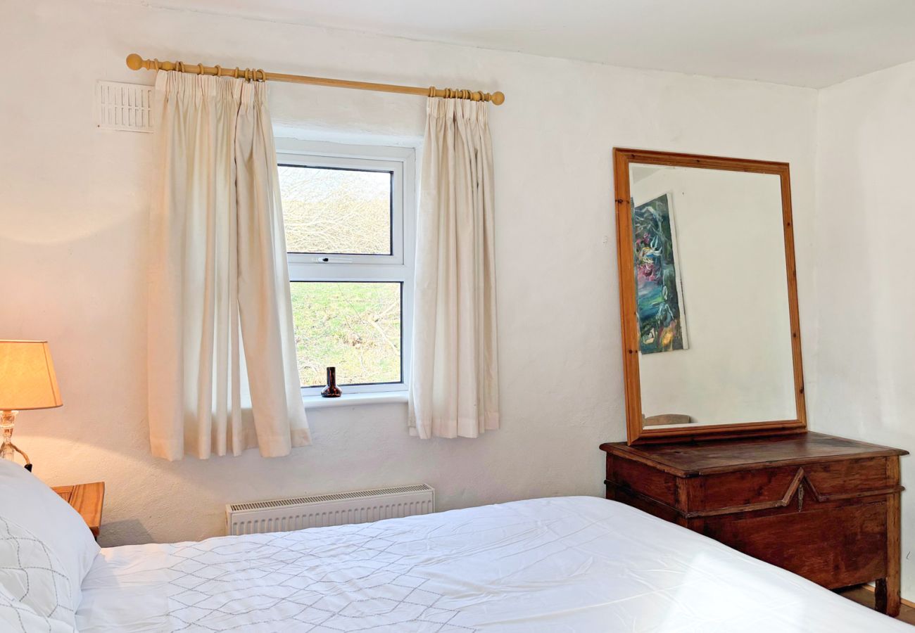 Moyard Stone Cottage, Connemara.  Double bedroom.  White simple cottage style, tasteful.
