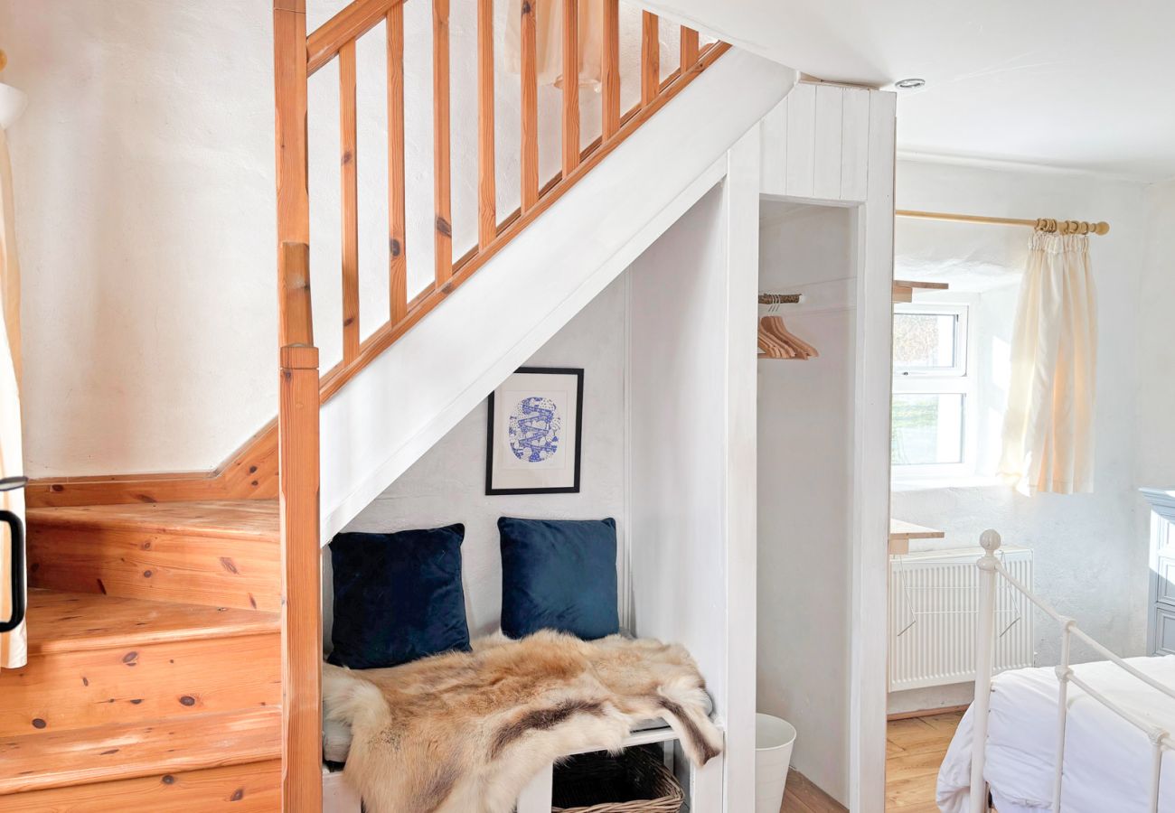 Moyard Stone Cottage, Connemara.  Bedroom, staircase, stylish cottage style. 