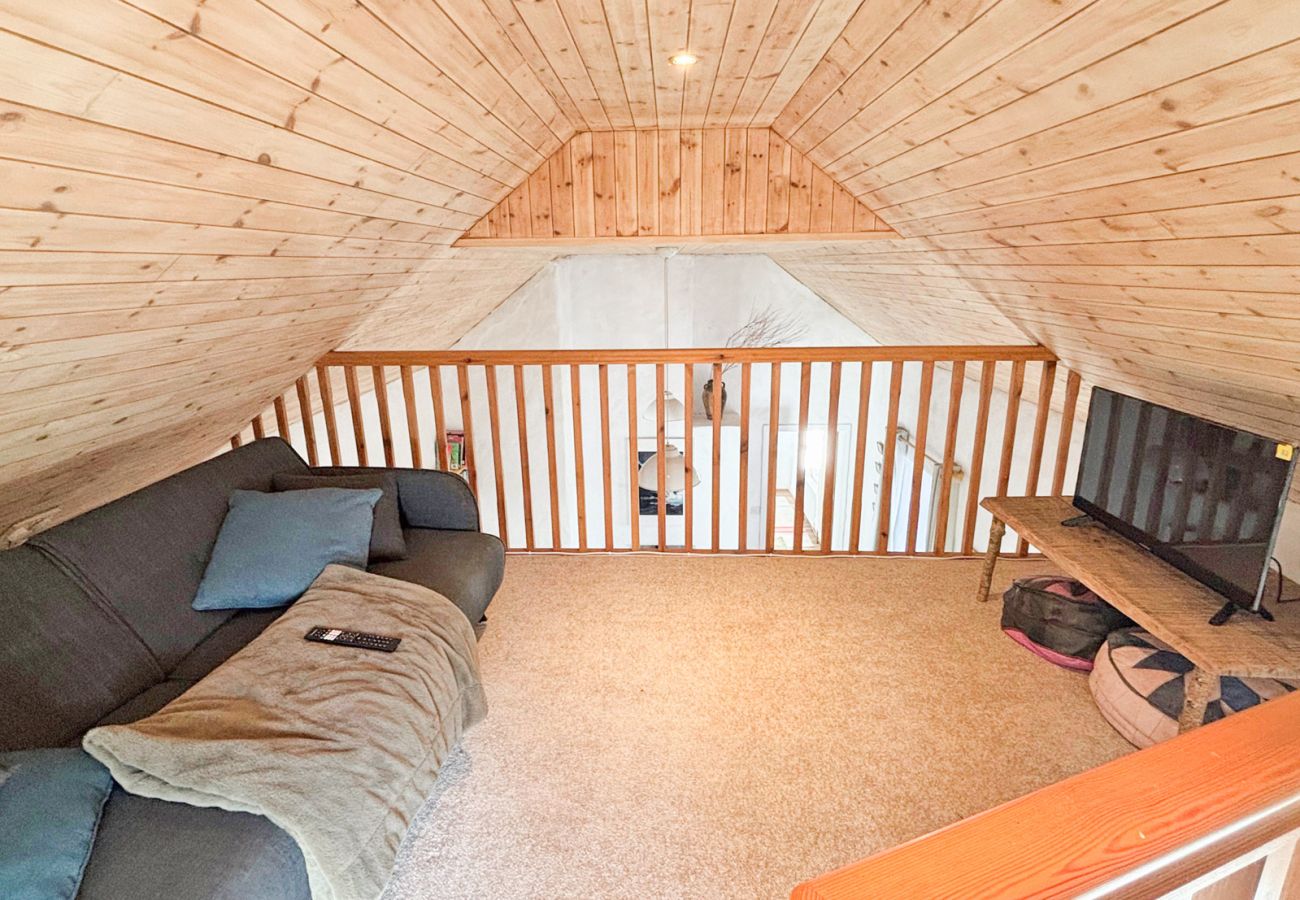 Moyard Stone Cottage, Connemara.  Mezzanine couch and TV