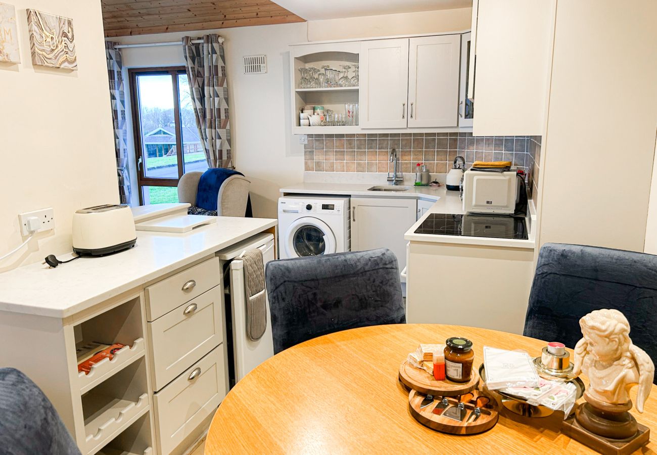 Glasson Mews Holiday Home No. 2. Compact kitchen with dining table. 