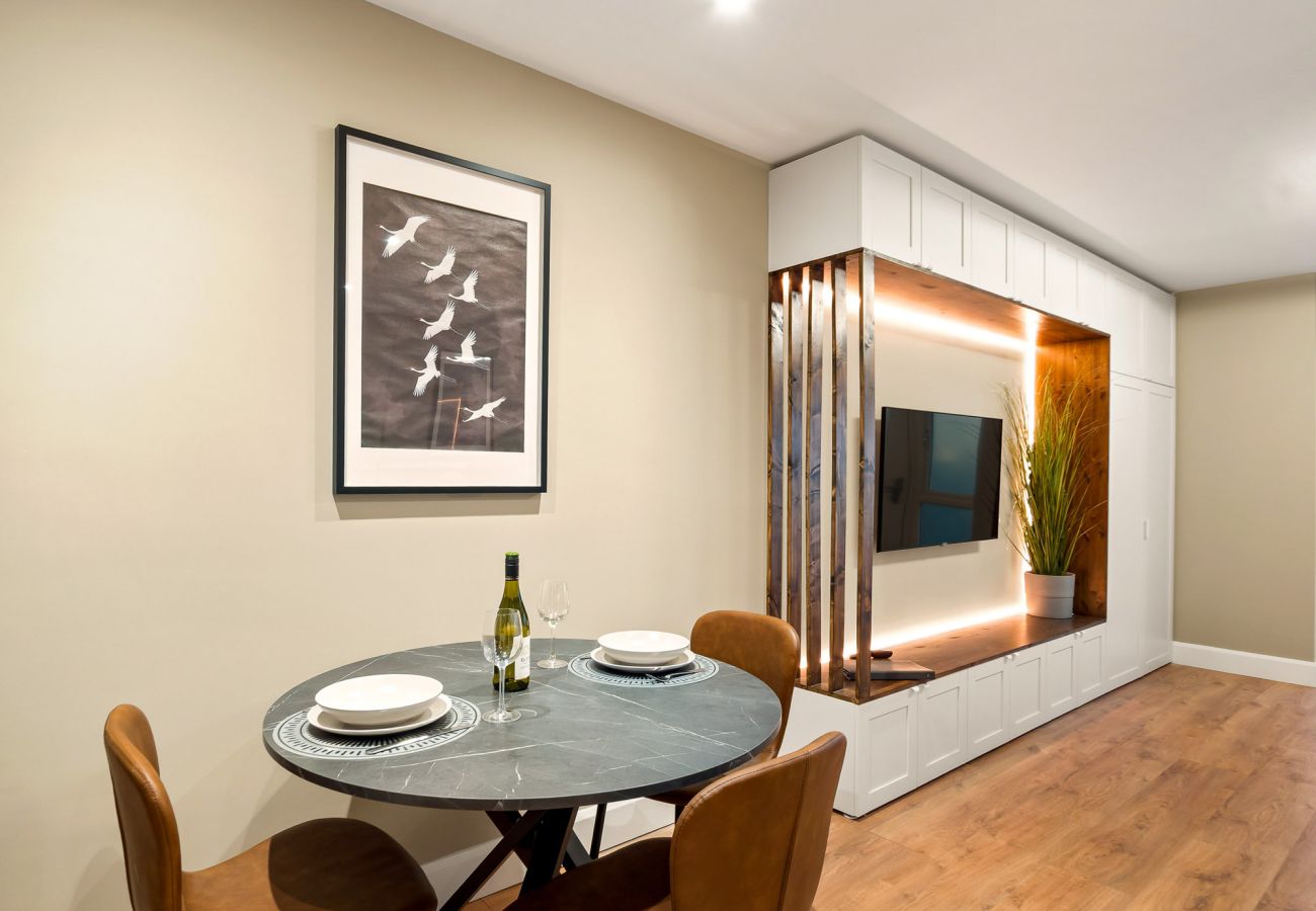 Main Street Hideaway Clifden. Living room large TV dining table for 3