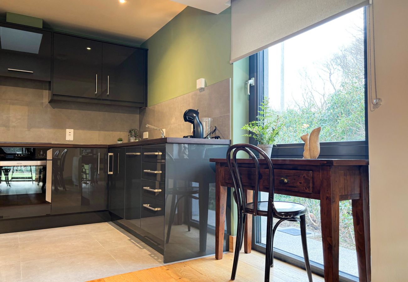 Kylemore Gate Lodge. Modern family holiday home stylish kitchen desk with view